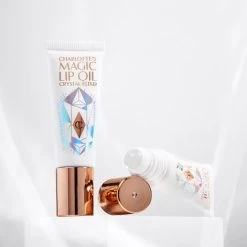 CHARLOTTE’S ICONIC MAGIC LIP TRIO 21 CHARLOTTE’S ICONIC MAGIC LIP TRIO -Fashion Cosmetics Shop Lip Oil Still Life